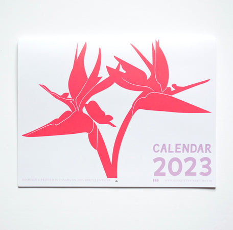 Front cover of Banquet's 2023 Calendar with a neon Bird of Paradis bloom.