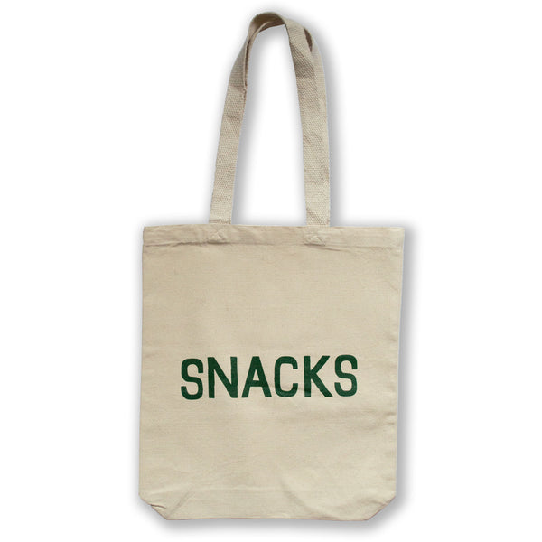 canvas tote bag printed with the word snacks in all caps