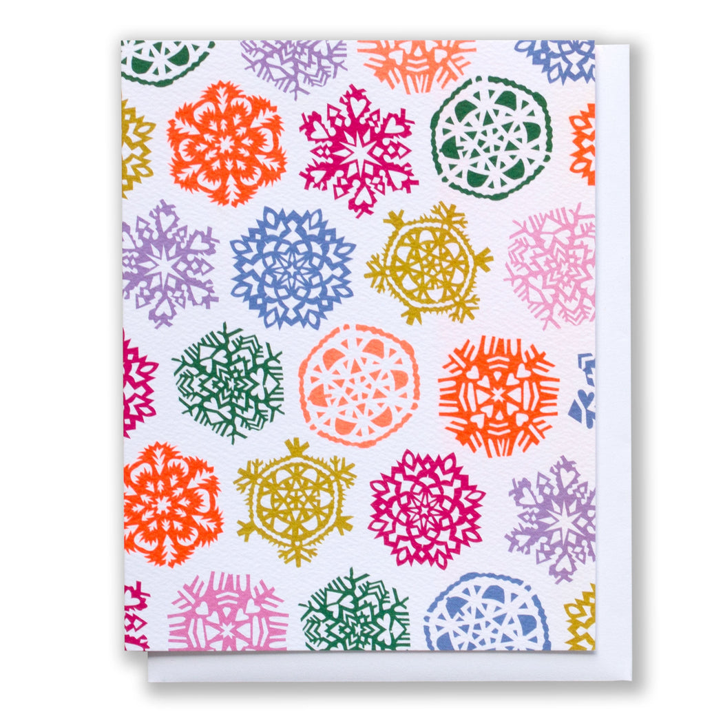 Note Card with multicoloured bright snowflakes on a white background