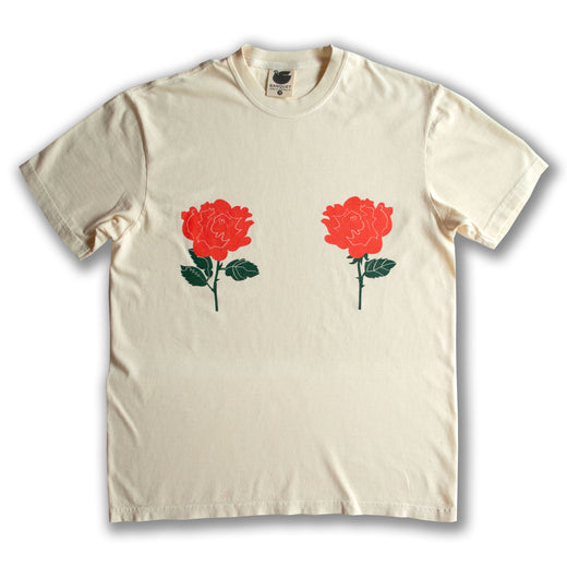 two red roses placed over each boob on a cream t-shirt