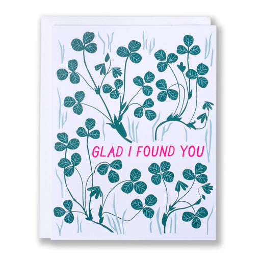 note card with Pink text that says Glad I Found You with hand drawn clovers with one drawing of a lucky four leaf clover