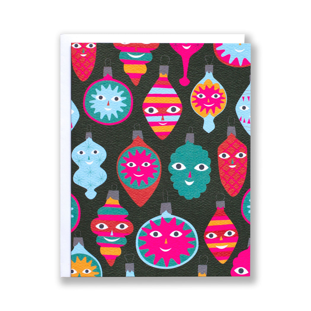 A holiday Christmas notecard with multicoloured bright ornaments with faces  Edit alt text