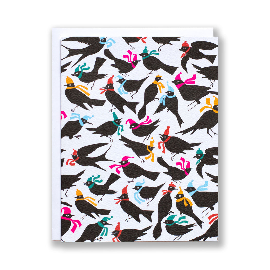 Black silhouettes if birds wearing brightly coloured scarves and winter hats on a hat note card