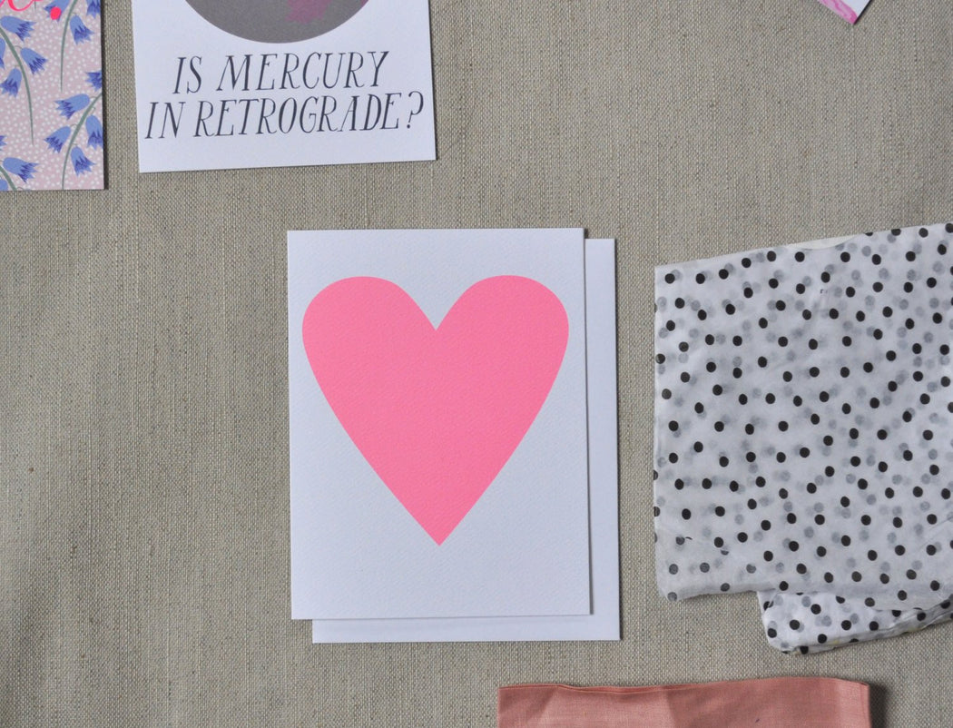 Baby pink heart card with other stationery including Is Mercury in Retrograde" note card.